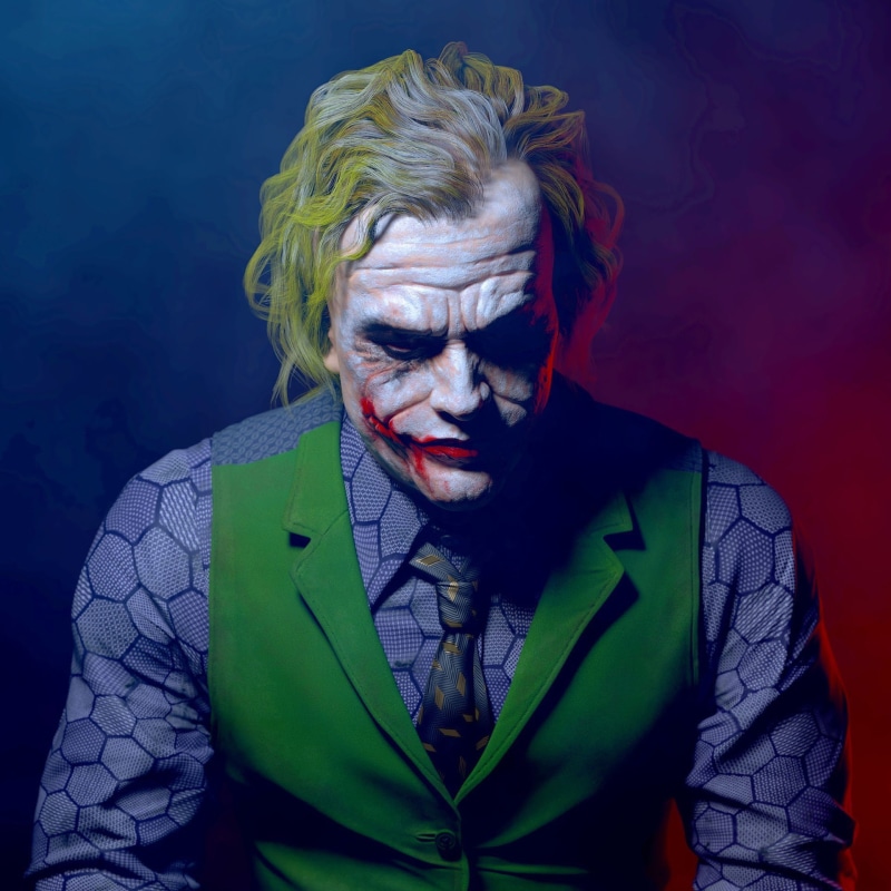 stage make-up, looking at camera, adult, Joker, indoors, 1080P, fantasy, headshot, one person, face paint, evil, hairstyle, Batman, portrait, spooky, paint