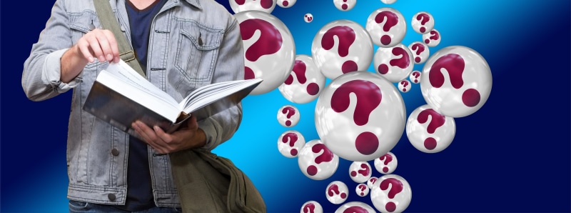 one person, adult, hand, blue, front view, university, knowledge, young, college, question mark, solutions, read, problems, holding, information, standing