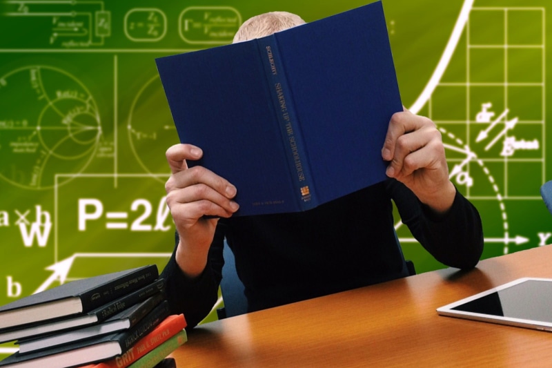 classroom, one person, 1080P, front view, board, activity, book, holding, human Hand, teacher, indoors, study, blackboard, reading, School, education