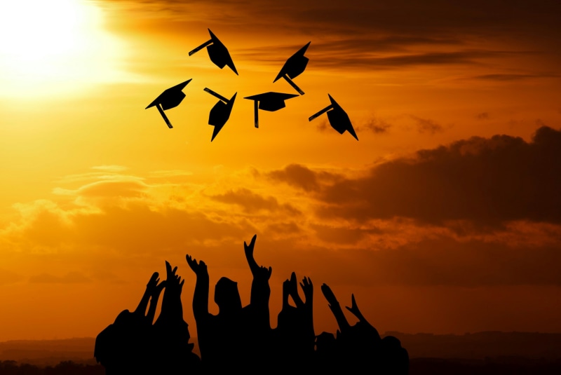 learn, orange color, throw, scenics - nature, high, caps, vocational, real people, human arm, flying, sunlight, degree, mid-air, silhouette, beauty in nature