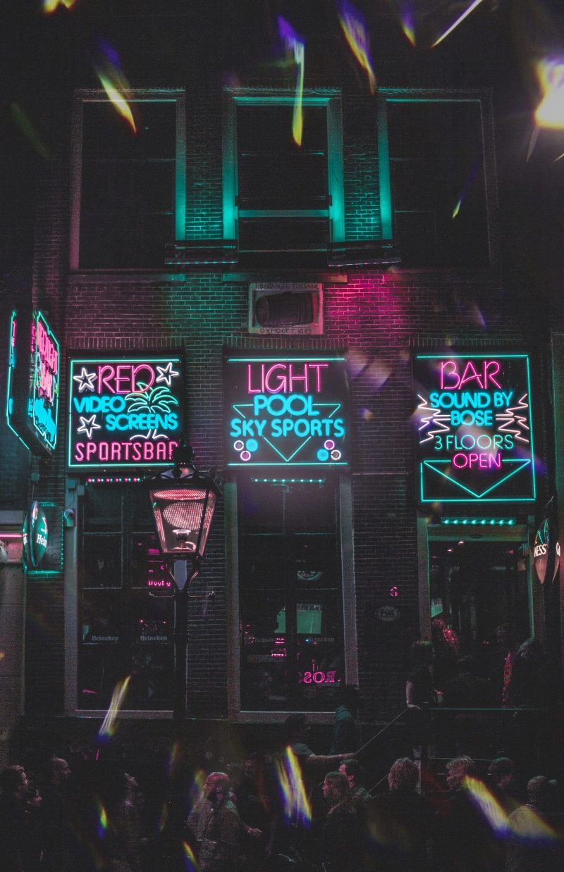 illuminated, night, wall, architecture, enjoyment, crowd, celebration, multi colored, communication, nightlife, real people, leisure activity, group of people