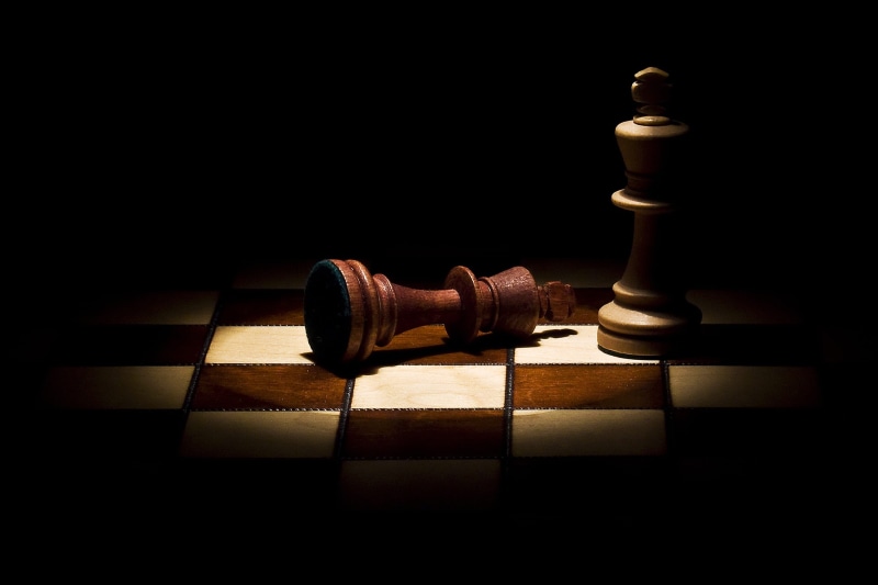 board game, wood - material, still life, 2K, checked pattern, game, mat, indoors, close-up, chess piece, no people, chess board, strategy, black background