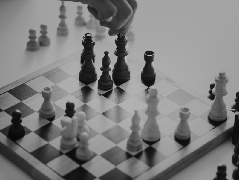 pawn - chess piece, chess piece, match - sport, high angle view, strategy, playing, indoors, arts culture and entertainment, checked pattern, white, hand