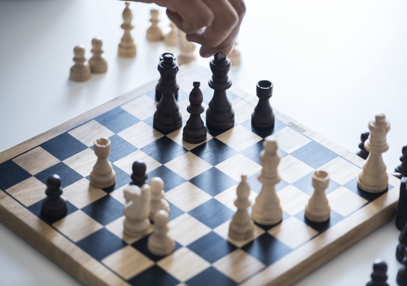 strategy, playing, solution, human body part, people, board game, chessboard, leisure games, hand, black color, queen - chess piece, relaxation, knight - chess piece