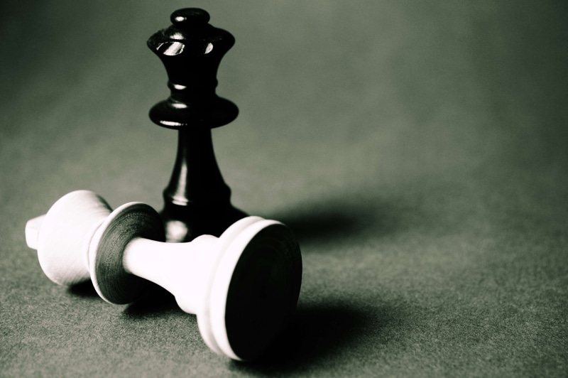 play, simplicity, recreation, no people, indoors, leisure games, wood, two objects, gray background, studio shot, intelligence, checkmate, game, aggression