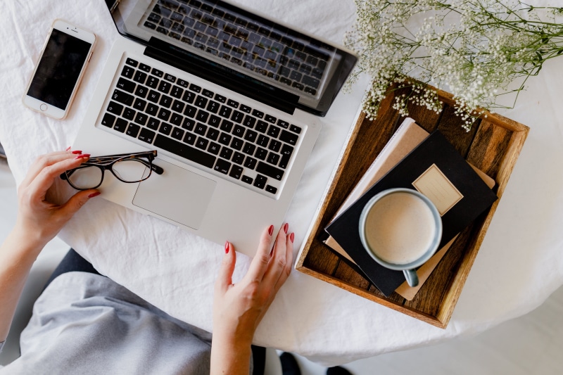 high angle view, adult, connection, drink, woman, table, human hand, late, coffee cup, one person, indoors, workspace, workplace, laptop, using laptop
