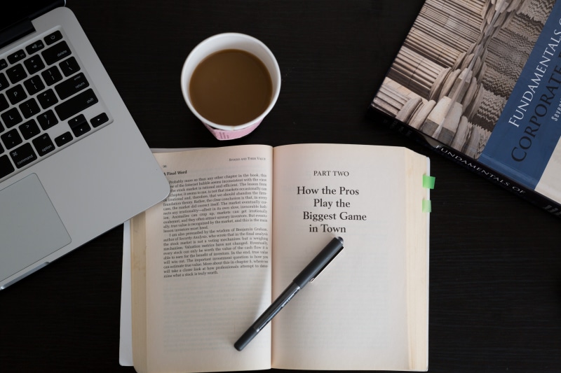books, reading, high angle view, coffee, pen, indoors, note pad, cup, desk, working, paper, finance, still life, refreshment, communication, keyboard, publication