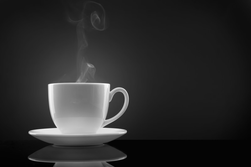 crockery, black background, white color, motion, studio shot, cup, still life, brown, saucer, single Object, tea cup, teacup, mocha, backgrounds, refreshment