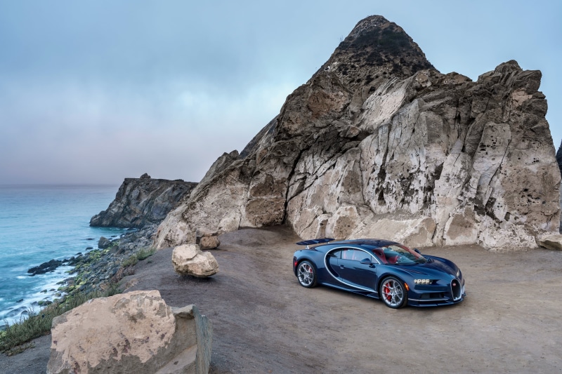 water, tranquil scene, mode of transportation, scenics, idyllic, car, beach, steep, mode of Transport, mountain, land Vehicle, sea, rock - Object, summer
