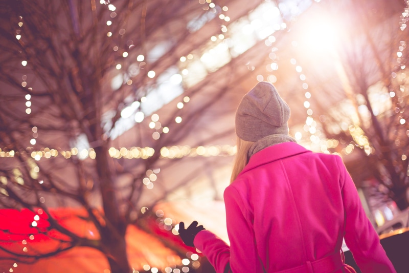 coat, warm Clothing, outdoors, celebration, lens flare, fashion, women, holiday, caucasian Ethnicity, focus on foreground, tree, plant, christmas lights