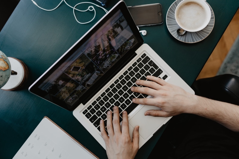 designer, cappucino, communication, mug, coffee, using laptop, connection, human hand, high angle view, laptop, work, human body part, cup, typing, office