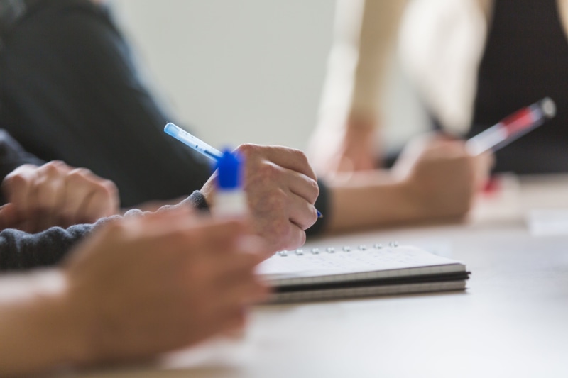 selective focus, note pad, men, people, photo, planning, holding, women, adult, table, close-up, Business, Professional, human hand, working, human body part