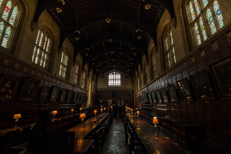arch, built structure, oxford, indoors, the way forward, incidental people, building, day, religion, aisle, direction, spirituality, architecture, place of worship