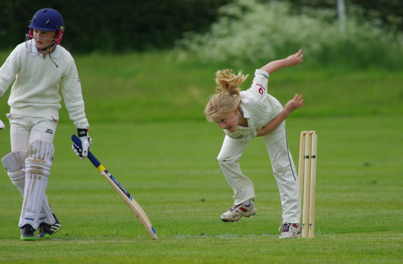 action, nature, sport of cricket, 5K, near, casual clothing, wicket, bat, cricket bowler, match, player, leisure activity, girl, playing, plant, competitive sport
