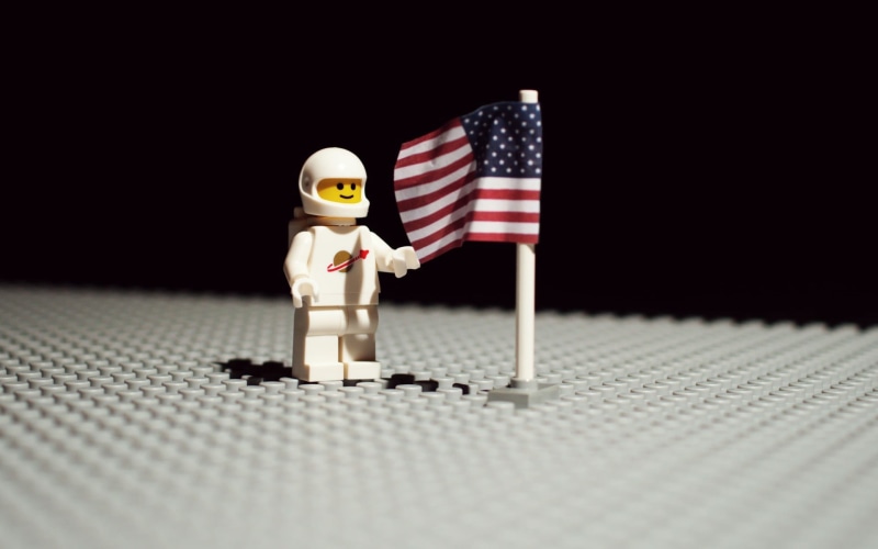 photo, two objects, white color, figurine, no people, representation, selective focus, minifigure, astronaut, male likeness, close-up, copy space, toys