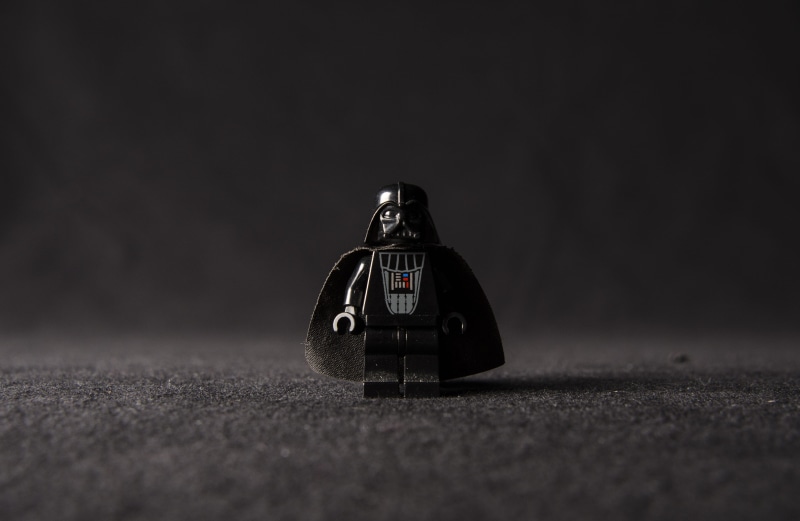 black background, word, miniature, land vehicle, sport, people, vader, outdoors, lego, toy car, photography themes, road, crystal, lego figure, costume