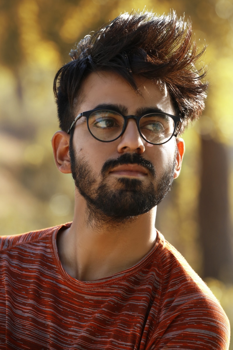 headshot, only men, confident, Portrait, lifestyles, young adult, beard, stylish, mustache, looking at camera, hair, happy, black, focus on foreground