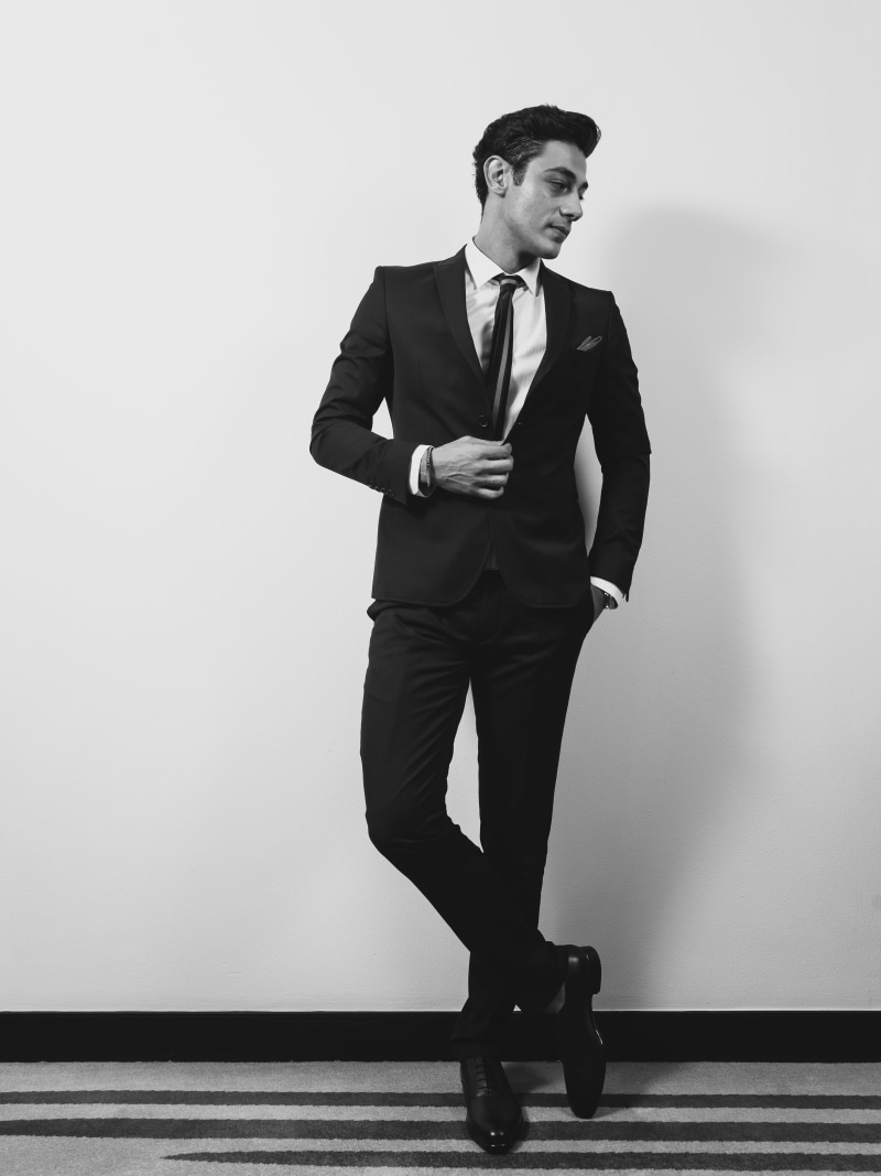 formalwear, suit, clothing, jacket, black and white, front view, men, one person, menswear, wall, fashionable, real people, young men, gentleman, wall - building feature