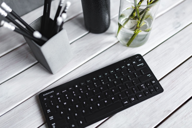 table, close-up, pencils, still life, computer key, computer, communication, high angle view, black, white, portable information device, bottle, wood - Material