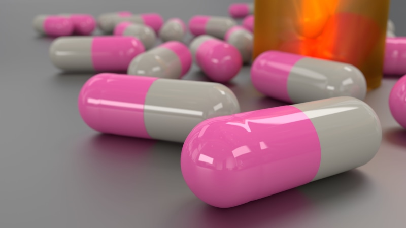 antibiotic, narcotic, drug, pills, studio shot, indoors, colored background, container, painkiller, treatment, science, pharmacy, cure, medicine, no people