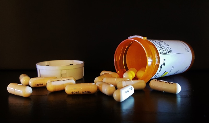 black background, pharmacy, pill, drugs, capsule, no people, studio shot, medicine, spilling, addiction, still life, container, healthcare And Medicine