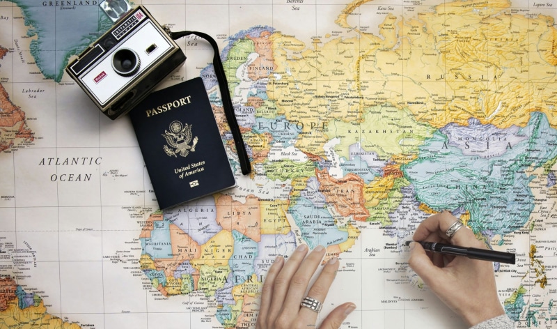 high angle view, navigation, camera, tourism, geography, people, writing, indoors, cartography, 2K, pen, topography, destination, explore, directly above