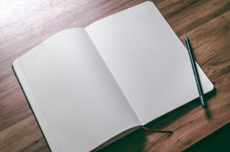 design, page, wood - material, table, blank, pencil, still life, book, write, directly above, day, no people, desk, notebook, pen, white color, notepad