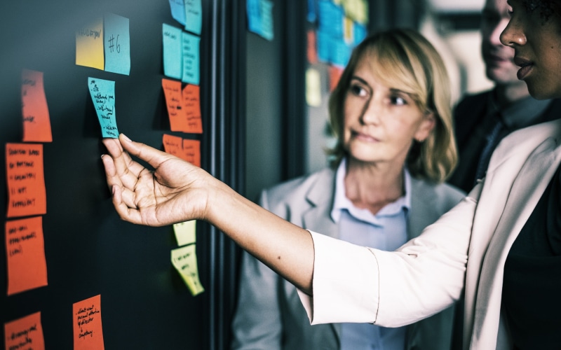 colleagues, finance, brainstorming, touching, plan, holding, occupation, gesturing, note, information, hand, communications, pointing, females, corporate business