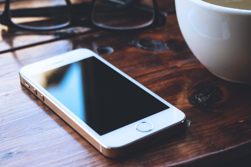portable information device, iPhone, touch Screen, wood - Material, telephone, internet, device screen, communication, coffee cup, refreshment, mobile Phone