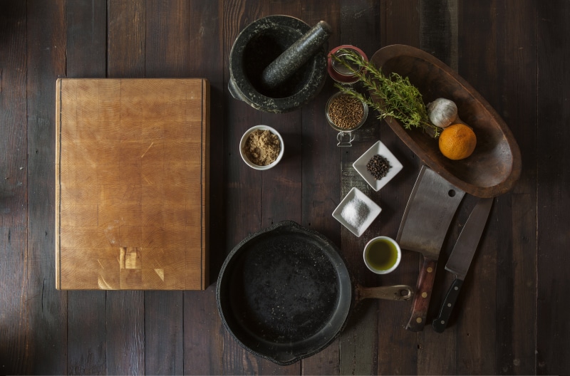 castiron, spices, high angle view, refreshment, kitchen utensil, food and drink, ceramic, wood, vegetables, pepper, orange, coffee, tea cup, beside, indoors