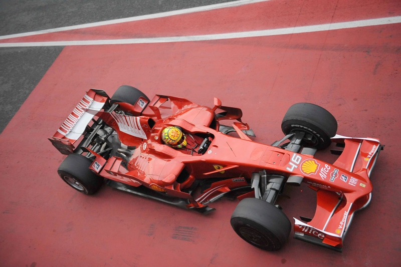 black, helmet, competitive sport, Formula 1, land vehicle, no people, car, accidents and disasters, rc, day, Ferrari, competition, outdoors, high angle view