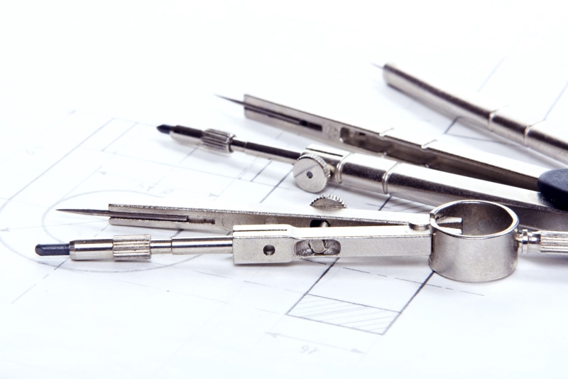 medium group of objects, metal, blueprint, choice, paper, engineering, still life, design, compasses, no people, close-up, studio shot, instrument, project