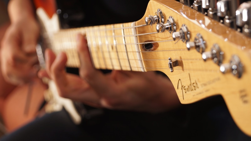 performance, musical equipment, string instrument, bass guitar, artist, stratocaster, music, plucking an instrument, playing, arts culture and entertainment