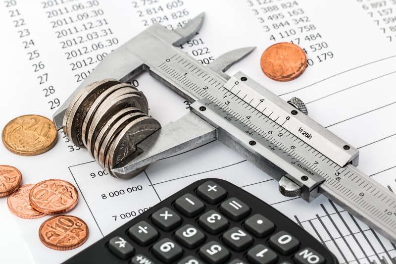 5K, coin, group of objects, corporate business, savings, vernier, financial, no people, investment, stressed, economy, calculating, analog, currency, white background