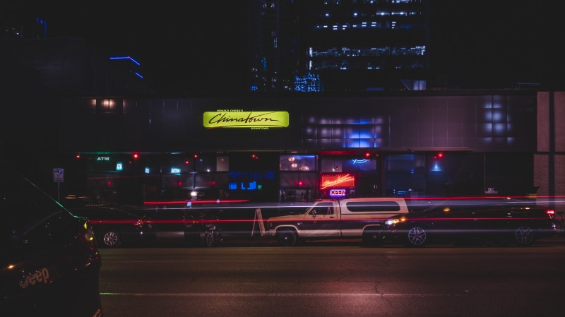 land vehicle, city life, evening, time-lapse, building exterior, cityscape, street, dusk, night, downtown, transportation, illuminated, nightlife, motion