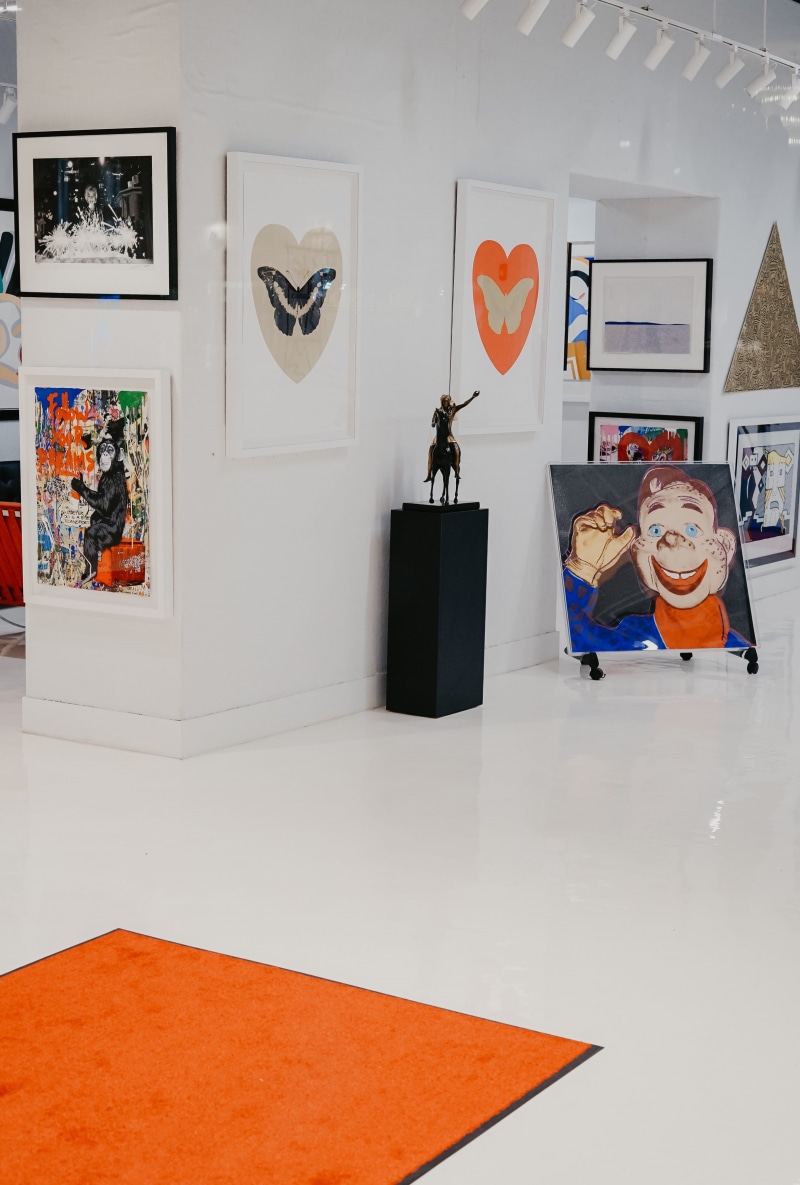trademark, tiled floor, 2K, frame, art and craft, table, orange color, arrow, person, paintings, architecture, home decor, color, creativity, furniture