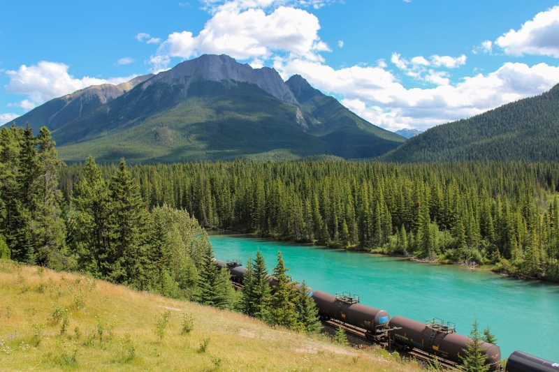 daytime, non-urban scene, cargo, equipment, lake, cloud - sky, retro, power, metal, turquoise colored, countryside, bow river, tranquil scene, sun, railway