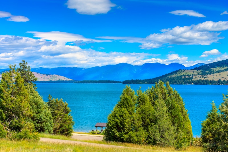 private, lake  mountain, road trip, mountains, mountain, Flathead Lake, green  lake, near, sky, tree, waters, beauty In Nature, United States of America