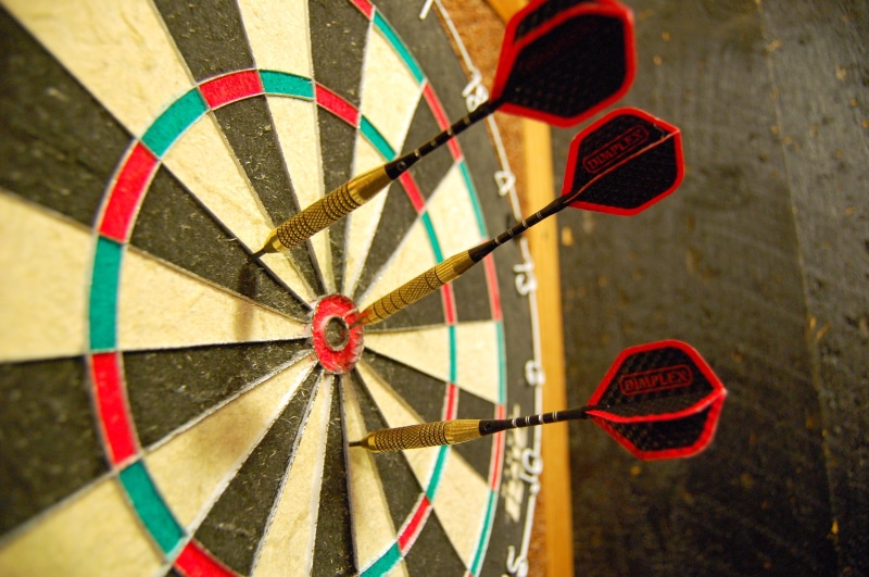 hitting, competition, recreation, winner, backgrounds, hit, red, aspirations, wall - building feature, board, midsection, geometric shape, aiming, art and craft