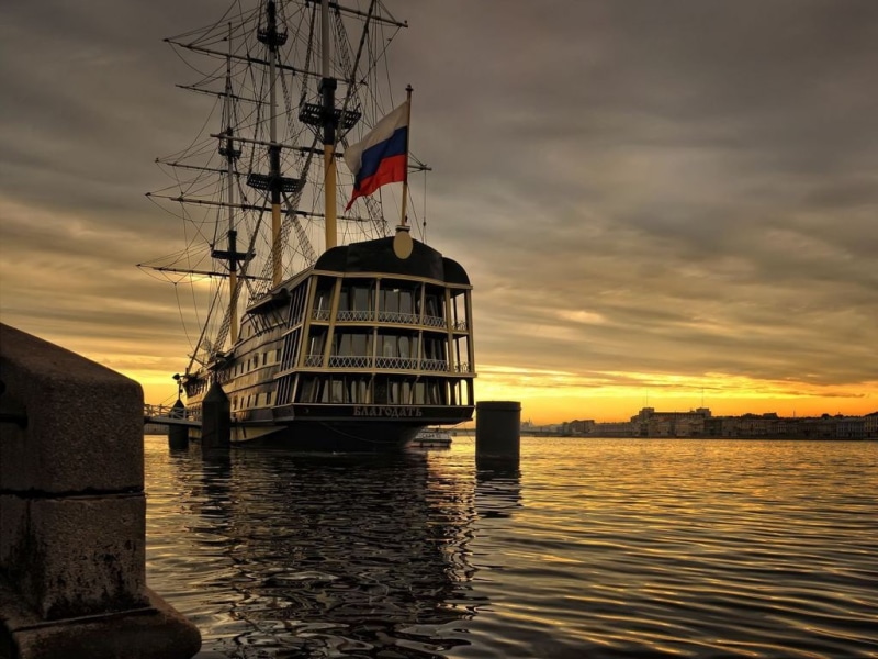 sailboat, basketball, ship, white, building exterior, sky, water, cloud - sky, beauty in nature, hoop, built structure, orange color, nautical vessel, architecture