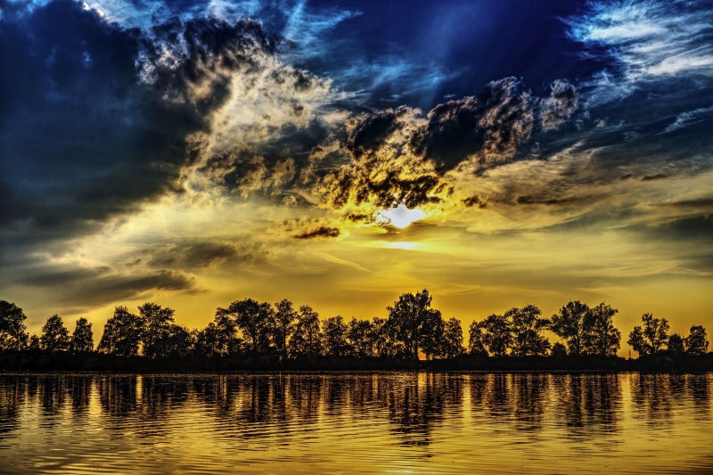 silhouette, no people, nature, non-urban scene, rest, daytime, tranquil scene, island, outdoors, idyllic, sun, quiet, water, cloud - sky, tree, mood, light