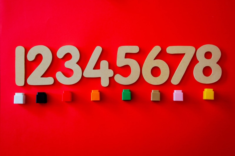 red background, no people, wall - building feature, red, business, mathematics, communication, decors, plus sign, message, blocks, colored background, numbers