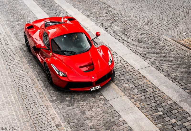 high angle view, land vehicle, mode of transportation, cobblestone, day, road, city, transportation, architecture, Ferrari, traffic, no people, Ferrari LaFerrari