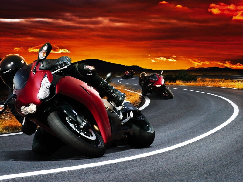 land vehicle, tire, 720P, bike, sky, mode of transportation, motion, competition, motorcycle, red, road, motor racing track, crash helmet, biker, sports