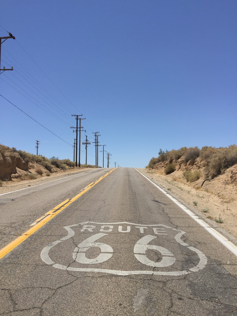 diminishing perspective, the way forward, connection, empty road, day, clear sky, marking, electricity, nature, dividing line, route, asphalt, vanishing point