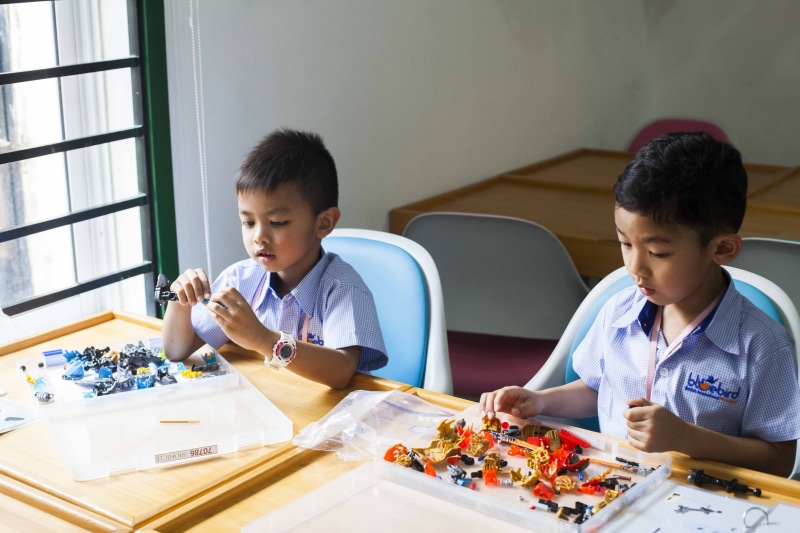 son, females, girls, family, indoors, bonding, males, brother, table, play-based learning, education, childhood, togetherness, smiling, Learning, elementary Age