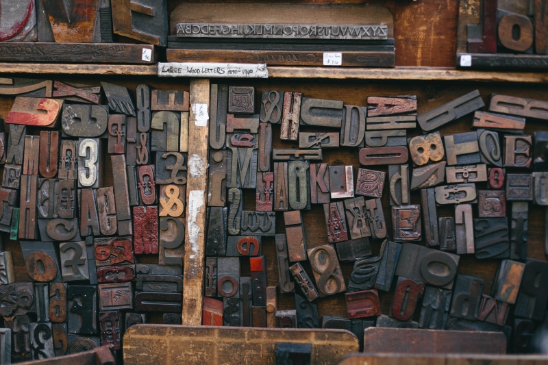 print, letter, font, backgrounds, wood type, abundance, day, publish, grunge, stained, no people, old, full frame, shelf, graphic design, vintage, grain
