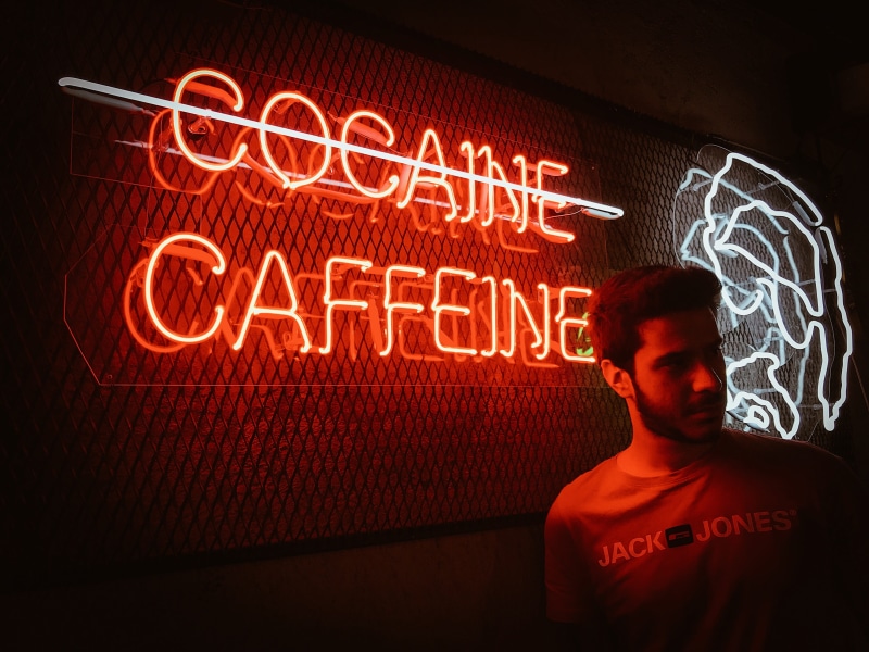 architecture, neon, one person, glowing, symbol, cocaine, illuminated, males, flare, communication, indoors, person, laser, signage, text, screen, men