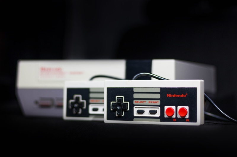 game, no people, black background, arts culture and entertainment, nes, game controllers, close-up, retro styled, nintendo, communication, camera - photographic equipment