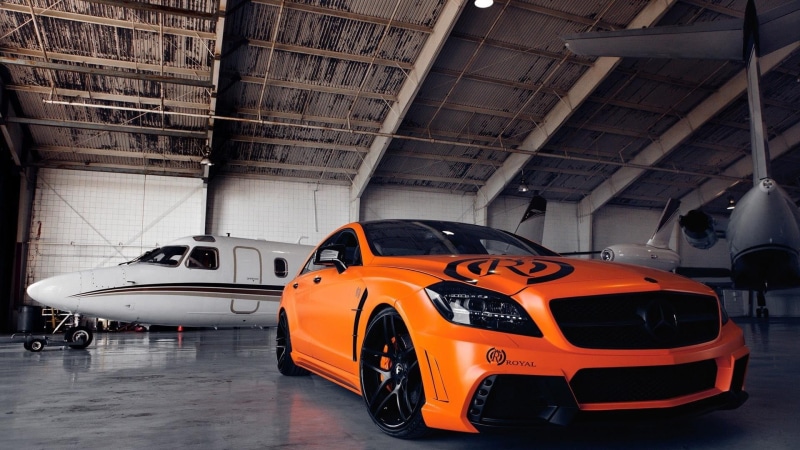 vehicle, transportation, benz, orange, indoors, mode of transportation, no people, airport, travel, air vehicle, Mercedes-Benz, occupation, coupe, aircraft